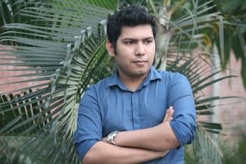 Faisal Tusher, arms crossed